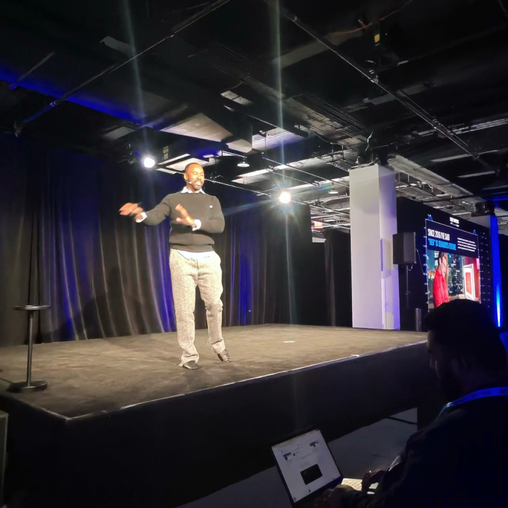 mike king speaking on stage at seo week 2026